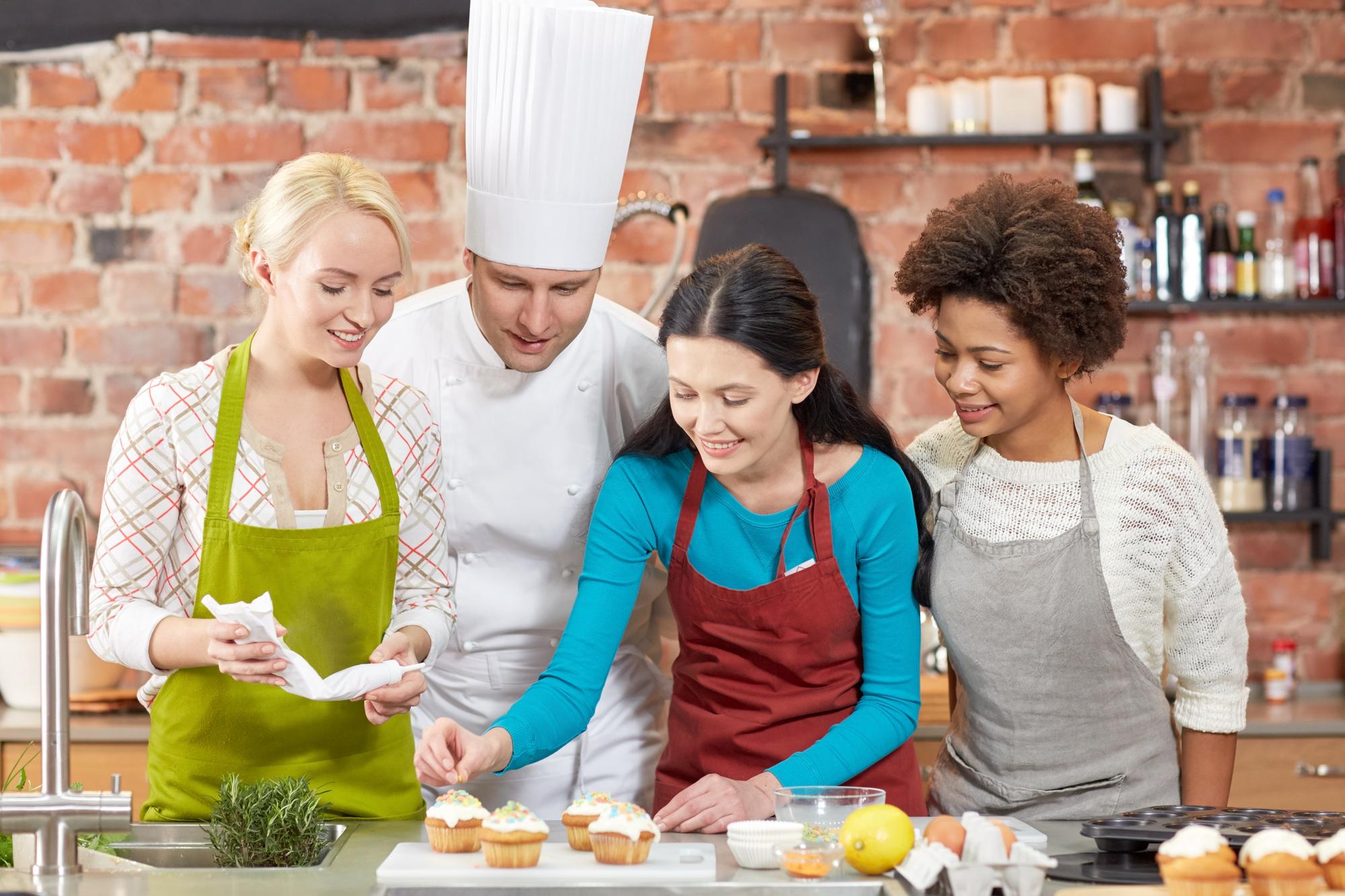 Participants plating a dessert together