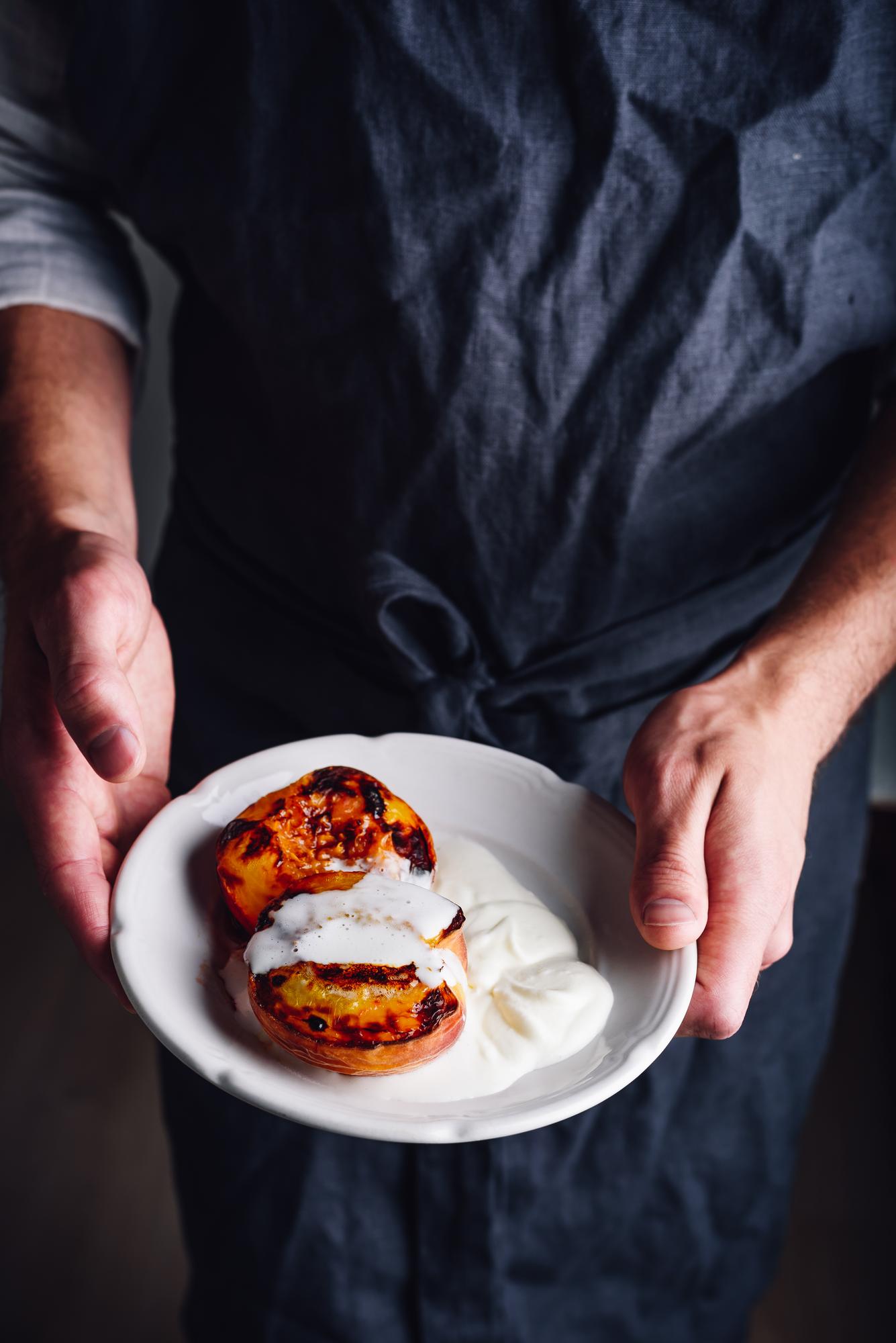 Chef preparing plated seasonal dish, close-up